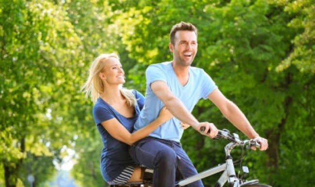 Couple riding a bike together